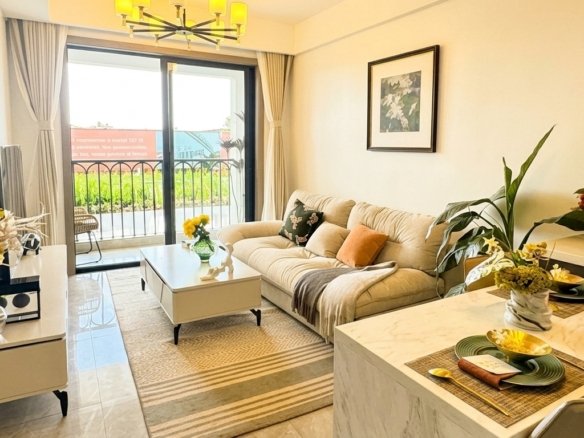 bright small living room neutral low profile sofa"