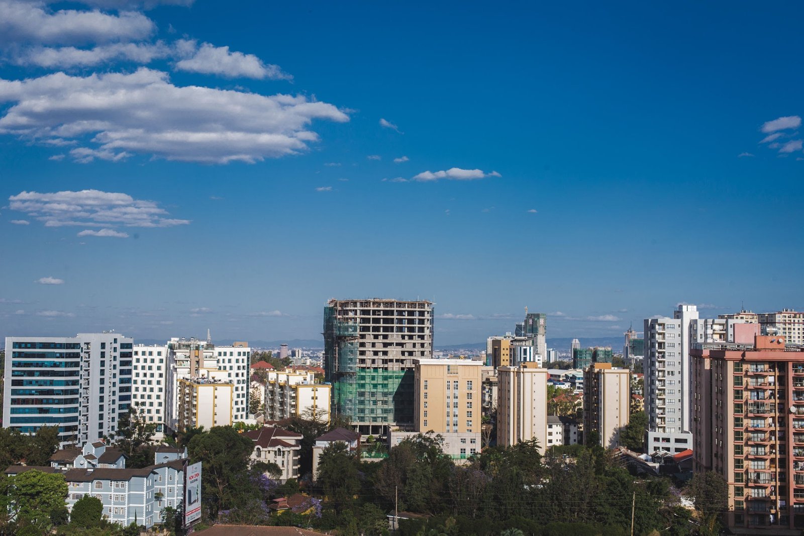 High-rise residential apartment towers under construction along the Nairobi skyline in Kenya